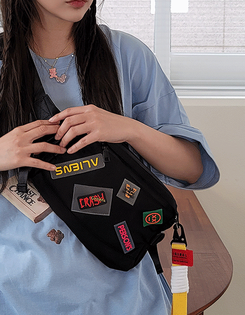 patched cross body bag